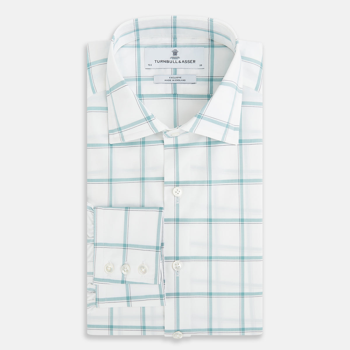 View 5 of product The Turnbull & Asser UK Large Checked Sage on White Tailored Fit Shirt in Cotton features white, long sleeves and button-up styling with a subtle sage check and light gray windowpane plaid pattern, neatly laid flat against a white background.