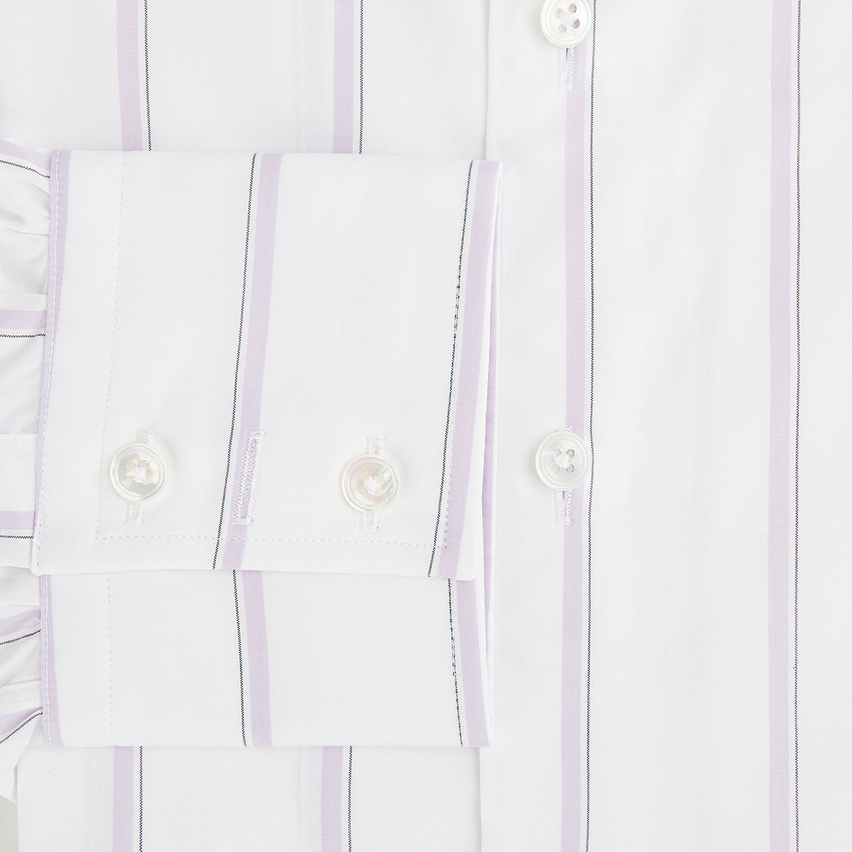 View 4 of product Track Striped Pink on White Tailored Fit Shirt in Cotton by Turnbull & Asser UK, featuring thin vertical pink stripes on white cotton, a classic collar, slim tailored fit, and buttoned cuffs, displayed on a plain white background.