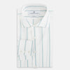 View 5 of product Track Striped Sage on White Tailored Fit Shirt in Cotton by Turnbull & Asser UK, featuring light blue vertical stripes, a classic collar, and cuffed long sleeves, displayed laid flat against a plain white background.