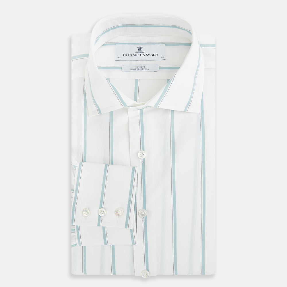 Track Striped Sage on White Tailored Fit Shirt in Cotton by Turnbull & Asser UK, featuring light blue vertical stripes, a classic collar, and cuffed long sleeves, displayed laid flat against a plain white background.