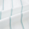 View 6 of product Track Striped Sage on White Tailored Fit Shirt in Cotton by Turnbull & Asser UK, featuring light blue vertical stripes, a classic collar, and cuffed long sleeves, displayed laid flat against a plain white background.