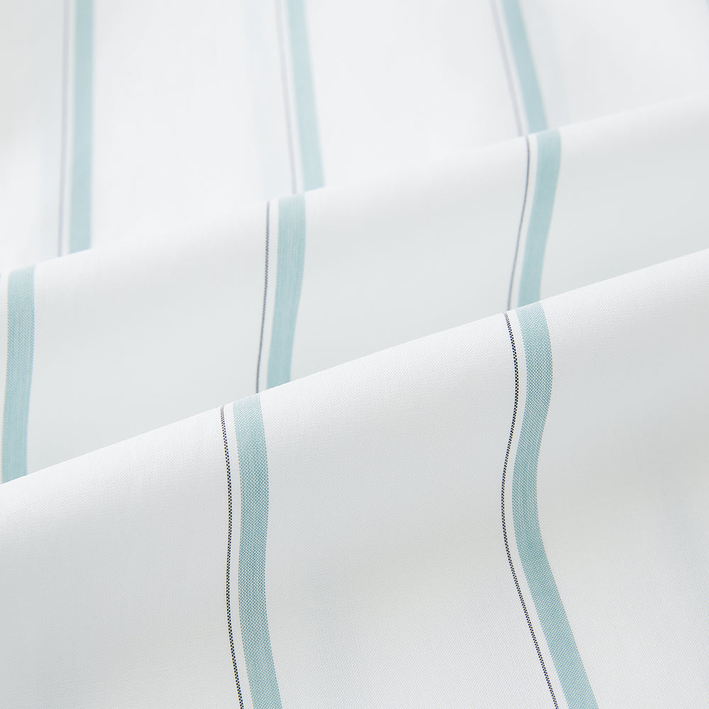 Track Striped Sage on White Tailored Fit Shirt in Cotton by Turnbull & Asser UK, featuring light blue vertical stripes, a classic collar, and cuffed long sleeves, displayed laid flat against a plain white background.