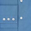 View 4 of product The Turnbull & Asser UK SHIRTS NEW TF KENT CLR 3BC COLONY BLUE/NAVY STRIPE is a long-sleeve button-up dress shirt featuring a pointed Kent collar, white buttons, and buttoned cuffs, shown against a plain white background.