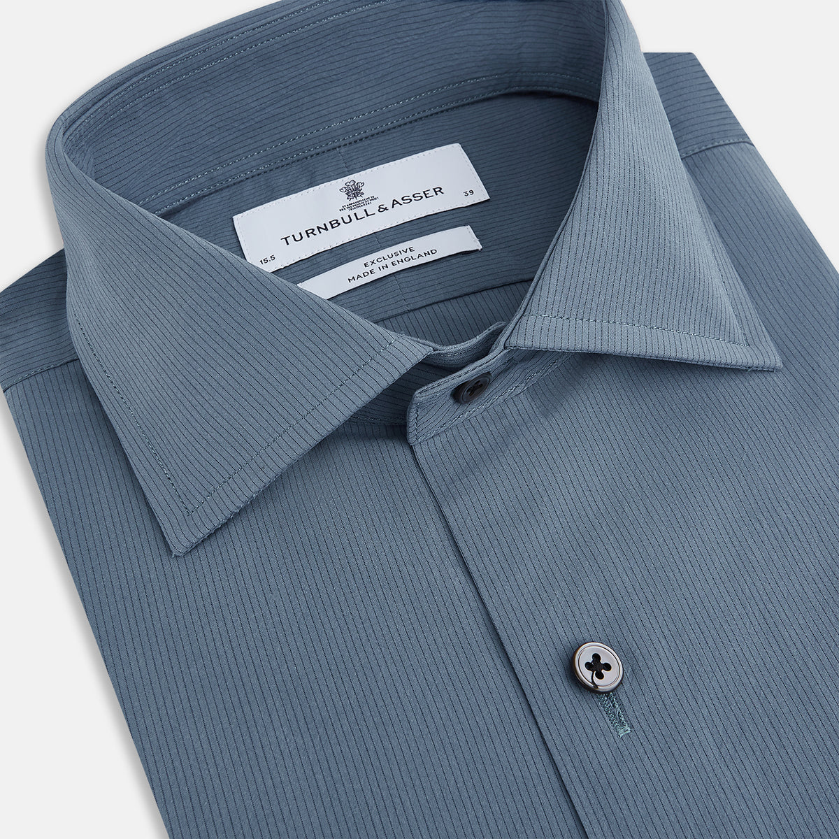 View 2 of product A long-sleeved, button-down Kent collar shirt by Turnbull & Asser UK, featuring a steel gray and navy stripe pattern, displayed on a plain white background.