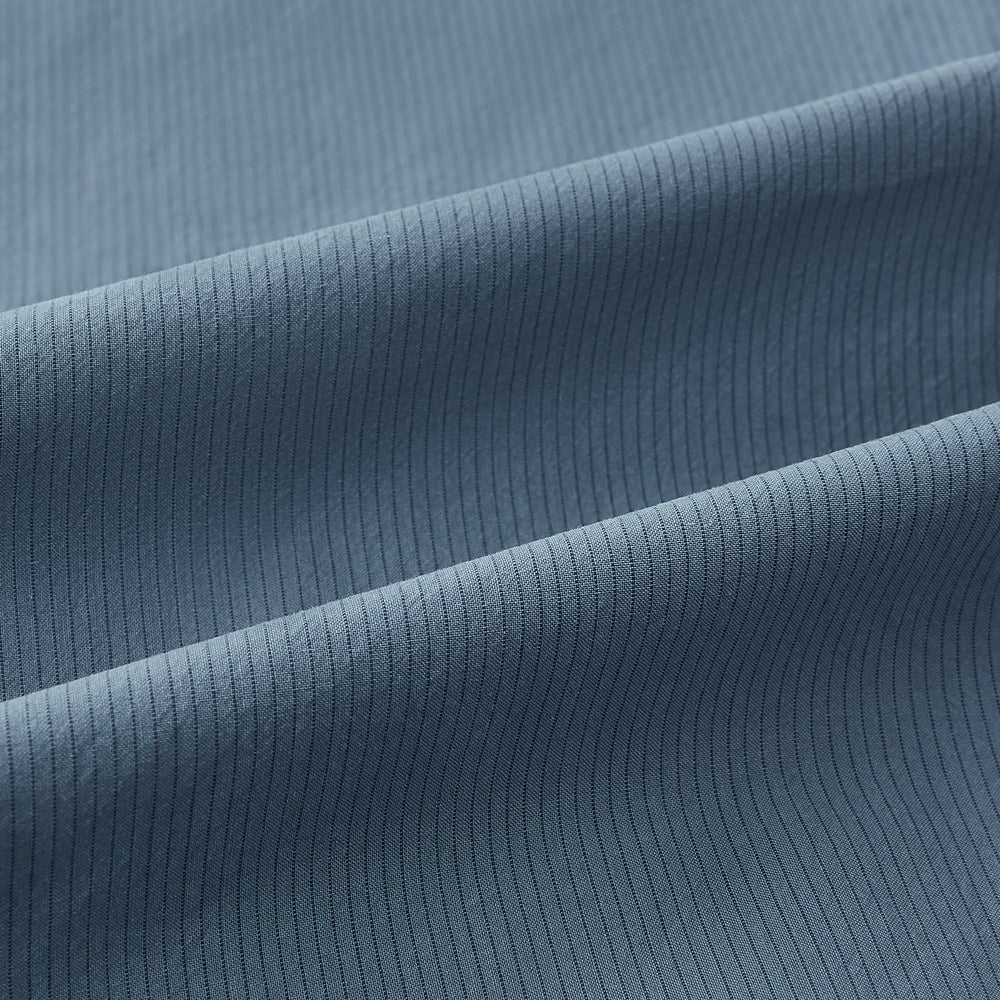 A long-sleeved, button-down Kent collar shirt by Turnbull & Asser UK, featuring a steel gray and navy stripe pattern, displayed on a plain white background.