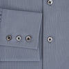 View 4 of product A long-sleeve, button-up men’s dress shirt by Turnbull & Asser UK, the SHIRTS NEW TF KENT CLR 3BC GRAY/NAVY STRIPE, featuring a pointed Kent collar and buttoned cuffs in a gray and navy stripe pattern, displayed against a plain white background.