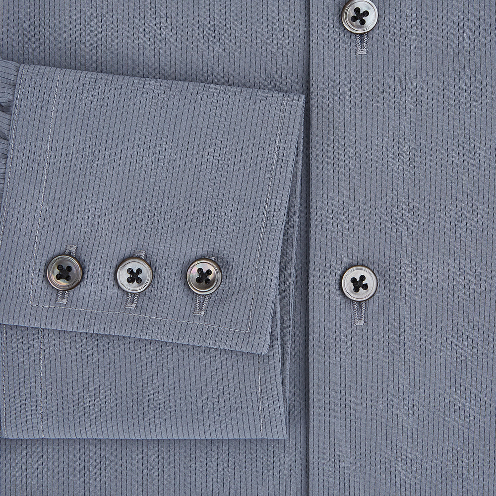 A long-sleeve, button-up men’s dress shirt by Turnbull & Asser UK, the SHIRTS NEW TF KENT CLR 3BC GRAY/NAVY STRIPE, featuring a pointed Kent collar and buttoned cuffs in a gray and navy stripe pattern, displayed against a plain white background.