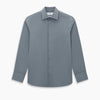 View 6 of product A long-sleeve, button-up men’s dress shirt by Turnbull & Asser UK, the SHIRTS NEW TF KENT CLR 3BC GRAY/NAVY STRIPE, featuring a pointed Kent collar and buttoned cuffs in a gray and navy stripe pattern, displayed against a plain white background.