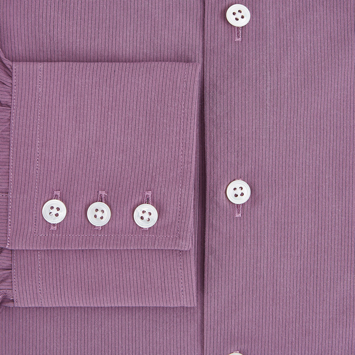 View 4 of product Displayed on a plain white background is the Turnbull & Asser UK Pinstriped Antique Pink Tailored Fit Shirt in Cotton, featuring long sleeves, a button-up front with crisp white buttons, and a classic kent collar in a refined mauve hue.