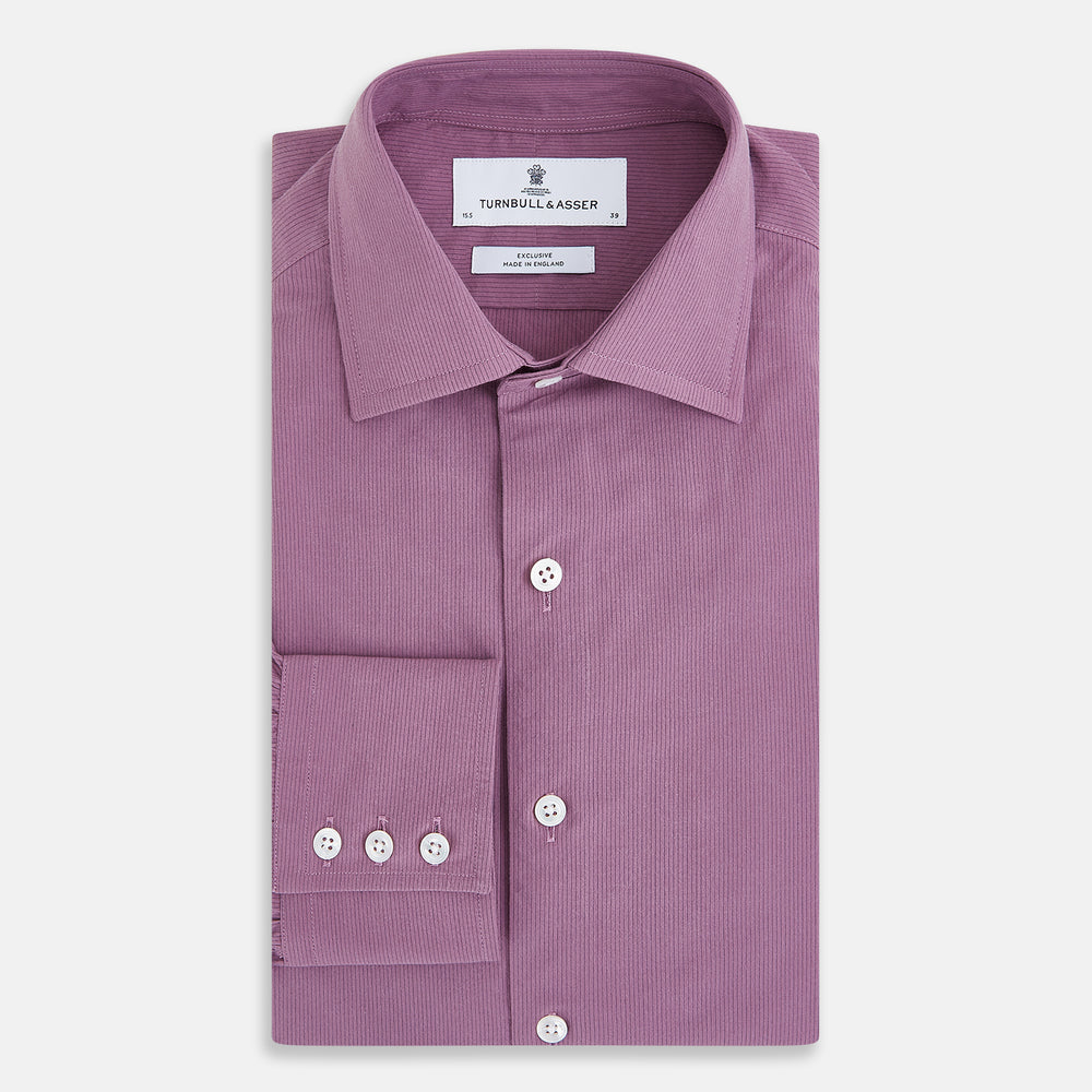 Displayed on a plain white background is the Turnbull & Asser UK Pinstriped Antique Pink Tailored Fit Shirt in Cotton, featuring long sleeves, a button-up front with crisp white buttons, and a classic kent collar in a refined mauve hue.