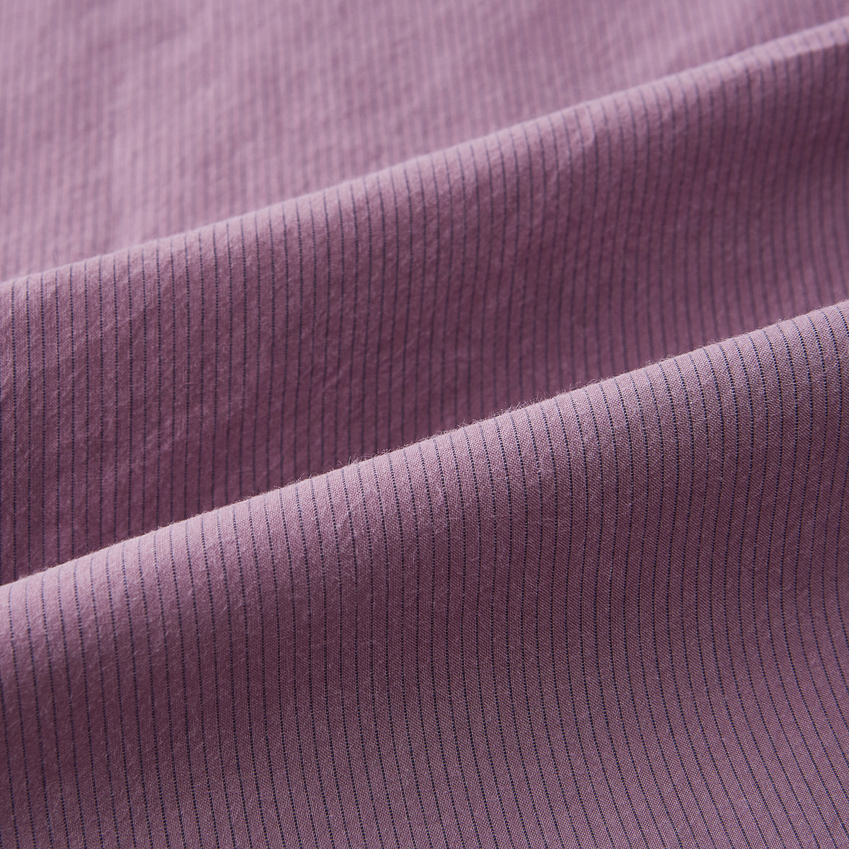 View 6 of product Displayed on a plain white background is the Turnbull & Asser UK Pinstriped Antique Pink Tailored Fit Shirt in Cotton, featuring long sleeves, a button-up front with crisp white buttons, and a classic kent collar in a refined mauve hue.