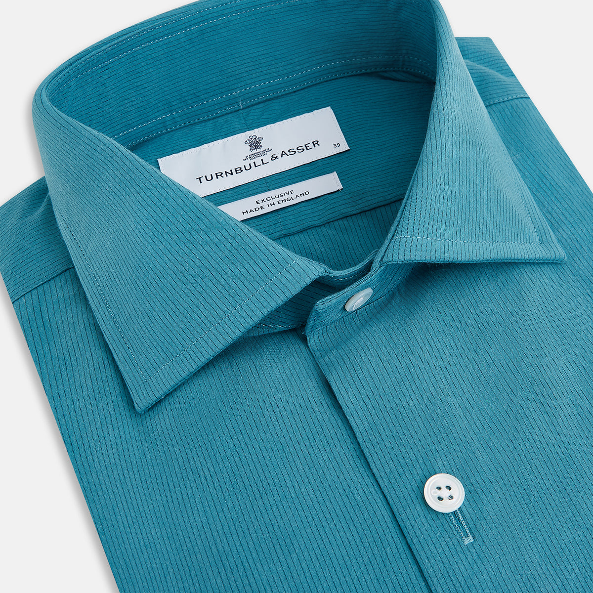 View 2 of product A Pinstriped Turquoise Tailored Fit Shirt in Cotton by Turnbull & Asser UK, styled as a classic long-sleeve button-up with a classic collar, white buttons, and buttoned cuffs—evoking the refined craftsmanship of traditional Turnbull & Asser shirts—displayed laid flat on a white background.
