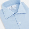 View 2 of product The Turnbull & Asser Tailored Fit Blue Cotton Cashmere Belgravia Shirt features a classic collar, button-down front, and buttoned cuffs, shown laid flat on a white background for a refined, formal look.
