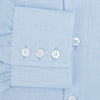 View 4 of product The Turnbull & Asser Tailored Fit Blue Cotton Cashmere Belgravia Shirt features a classic collar, button-down front, and buttoned cuffs, shown laid flat on a white background for a refined, formal look.