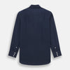 View 3 of product The Turnbull & Asser Tailored Fit Navy Cotton Cashmere Belgravia Shirt features a classic collar, white buttons, and long sleeves, shown on a white background.