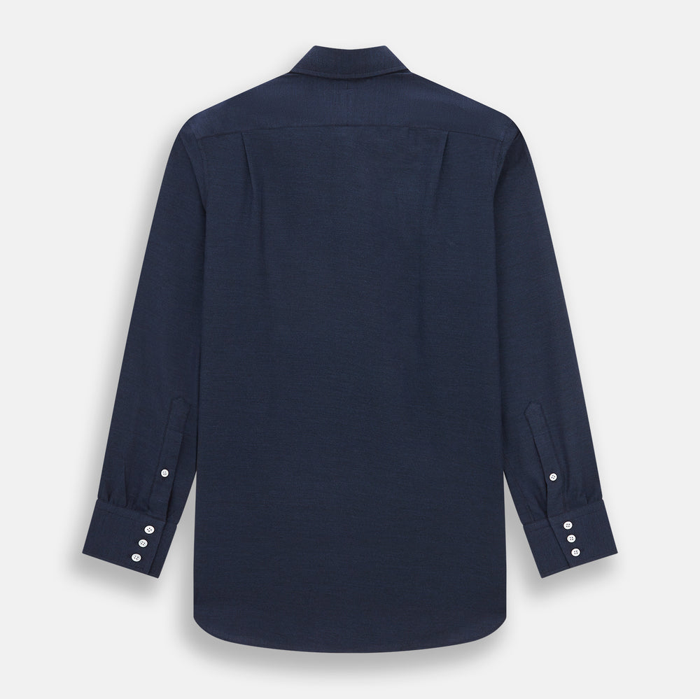 The Turnbull & Asser Tailored Fit Navy Cotton Cashmere Belgravia Shirt features a classic collar, white buttons, and long sleeves, shown on a white background.