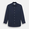 View 1 of product The Turnbull & Asser Tailored Fit Navy Cotton Cashmere Belgravia Shirt features a classic collar, white buttons, and long sleeves, shown on a white background.
