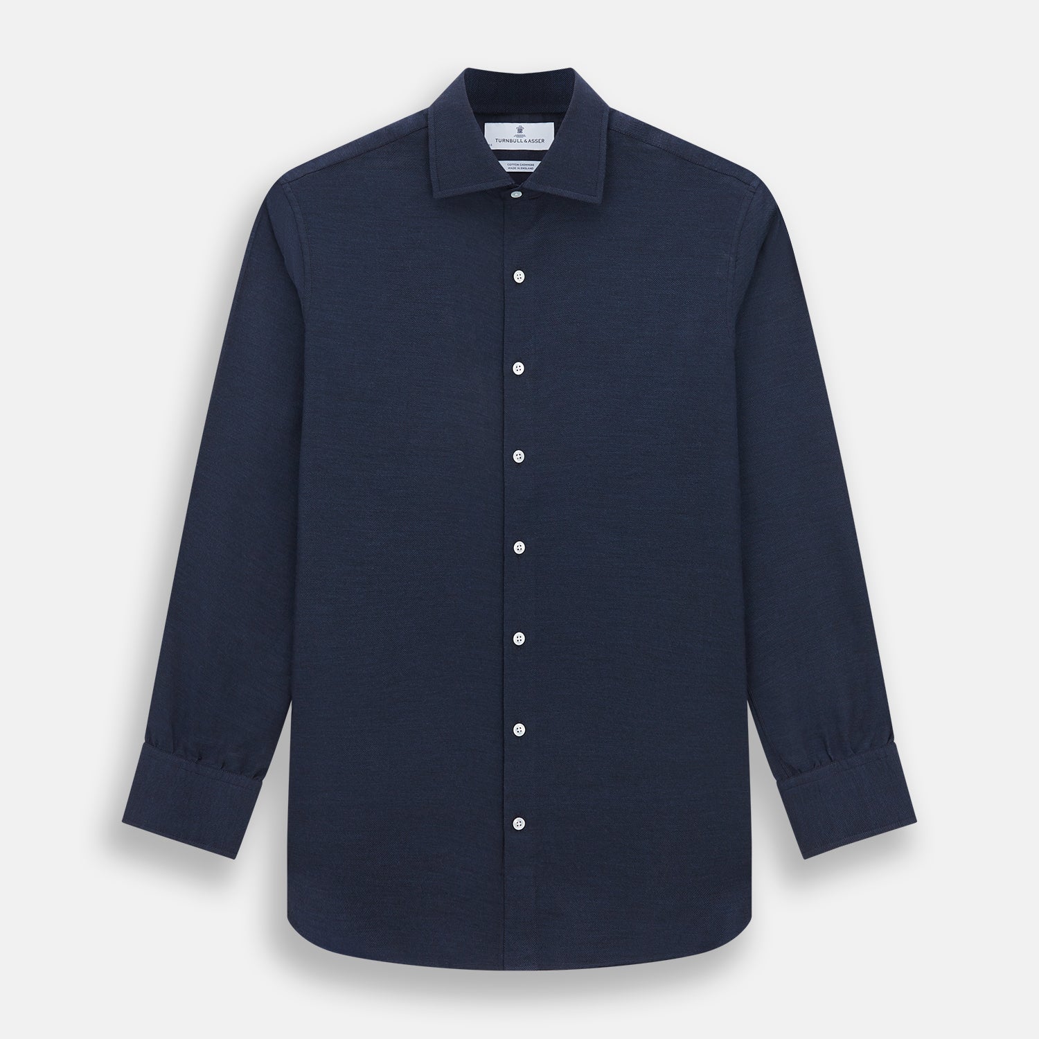 View 1 of product The Turnbull & Asser Tailored Fit Navy Cotton Cashmere Belgravia Shirt features a classic collar, white buttons, and long sleeves, shown on a white background.
