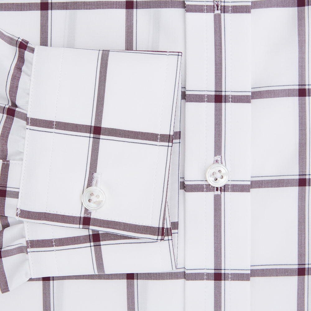 A Turnbull & Asser UK SHIRTS WF DERBY COLLAR 1BC 1PKT WHT/BURG MULTI CHK—a long-sleeve, button-up shirt in white with a burgundy multi-check pattern, featuring a classic derby collar and a single front pocket on the left side.