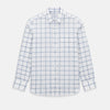 View 1 of product Large Checked Grey on White Weekend Fit Shirt in Cotton by Turnbull & Asser UK, featuring a white long-sleeve button-up design with a grey windowpane check pattern, front chest pocket, pointed derby collar, and buttoned cuffs, displayed flat on a plain white background.