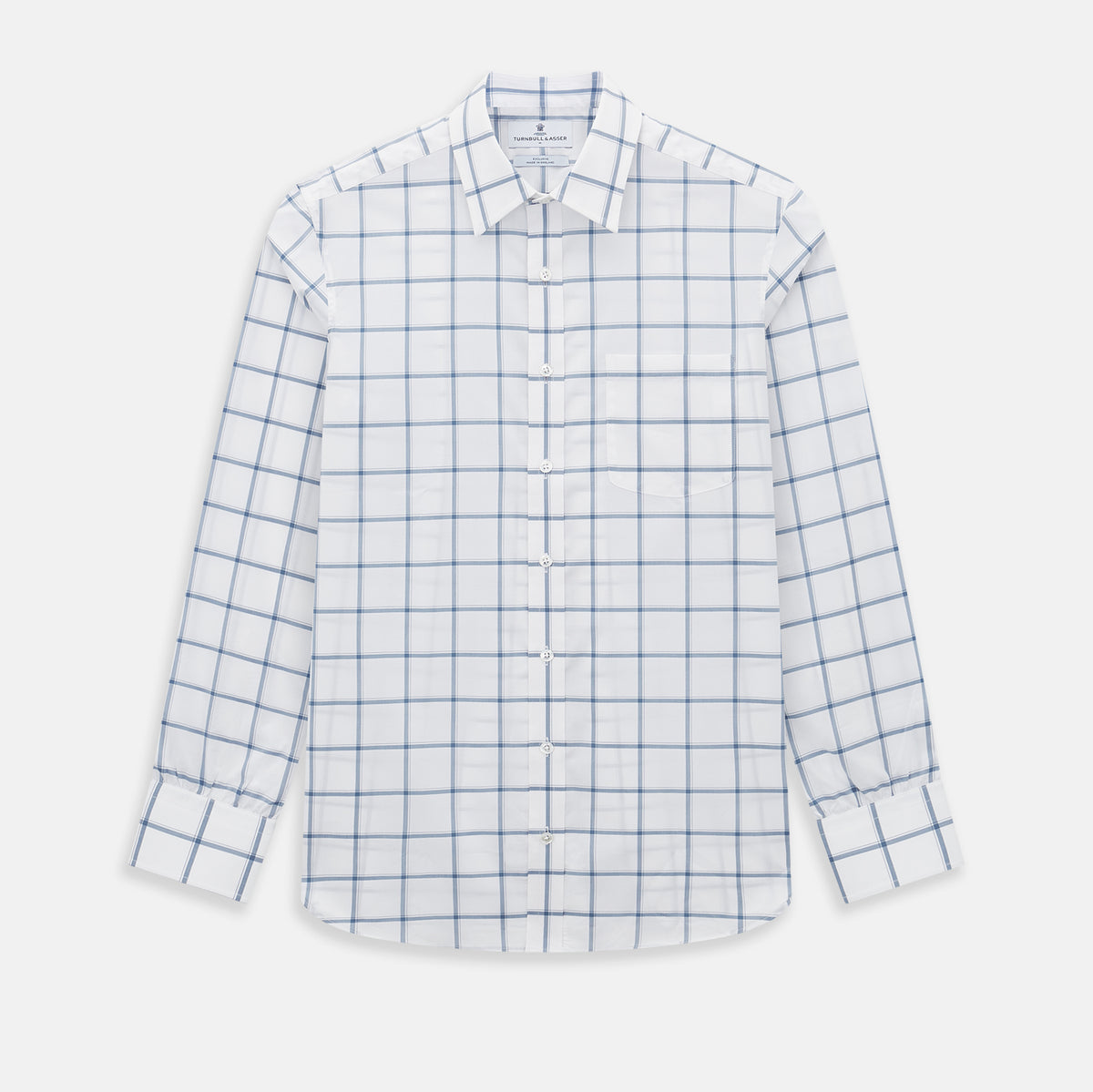 View 1 of product Large Checked Grey on White Weekend Fit Shirt in Cotton by Turnbull & Asser UK, featuring a white long-sleeve button-up design with a grey windowpane check pattern, front chest pocket, pointed derby collar, and buttoned cuffs, displayed flat on a plain white background.
