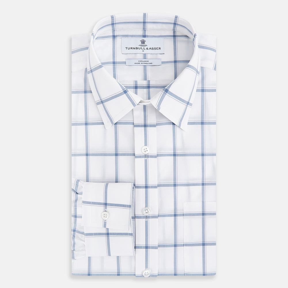 Large Checked Grey on White Weekend Fit Shirt in Cotton by Turnbull & Asser UK, featuring a white long-sleeve button-up design with a grey windowpane check pattern, front chest pocket, pointed derby collar, and buttoned cuffs, displayed flat on a plain white background.