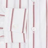 View 4 of product The Turnbull & Asser UK Track Striped Red on White Weekend Fit Shirt in Cotton features bold dark red stripes on a crisp white base, with long sleeves, a derby collar, front chest pocket, and buttoned cuffs, laid flat on a white background for a timeless men’s dress shirt aesthetic.