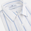 View 2 of product The Turnbull & Asser UK Track Striped Blue on White Weekend Fit Shirt in Cotton is a long-sleeve, button-up shirt featuring blue stripes on premium white Italian cotton, a Derby collar, and a chest pocket, elegantly laid flat against a white background.