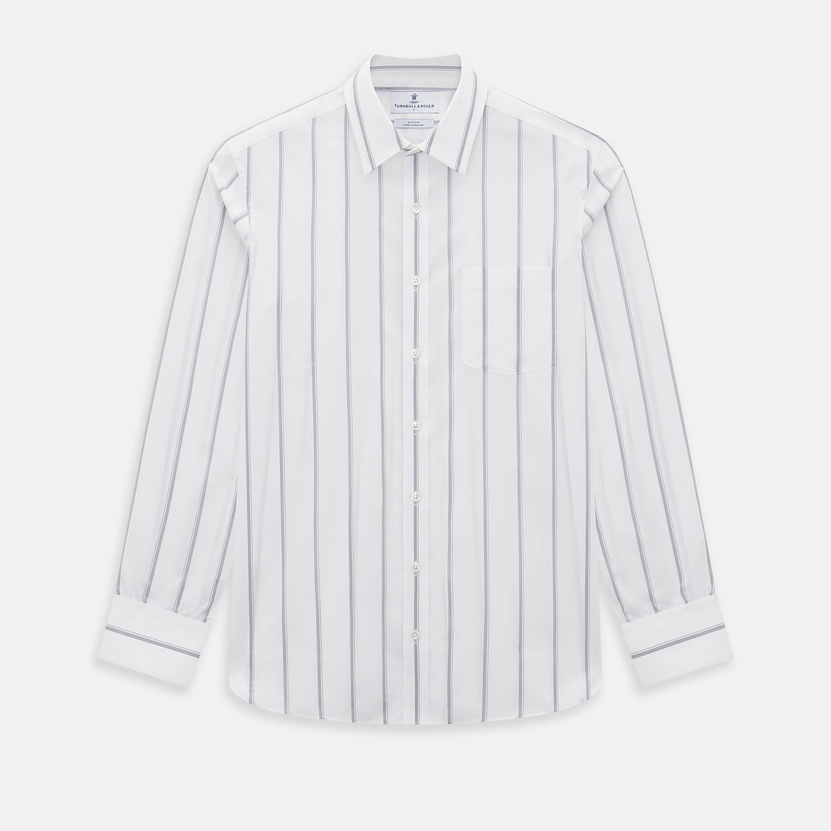 View 1 of product Introducing the Track Striped Grey on White Weekend Fit Shirt in Cotton by Turnbull & Asser UK—a men’s long-sleeve dress shirt crafted from crisp white cotton, featuring vertical grey stripes, a button-down front, derby collar, cuffs, and a chest pocket. The shirt is displayed laid flat on a white surface.