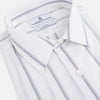 View 2 of product Introducing the Track Striped Grey on White Weekend Fit Shirt in Cotton by Turnbull & Asser UK—a men’s long-sleeve dress shirt crafted from crisp white cotton, featuring vertical grey stripes, a button-down front, derby collar, cuffs, and a chest pocket. The shirt is displayed laid flat on a white surface.