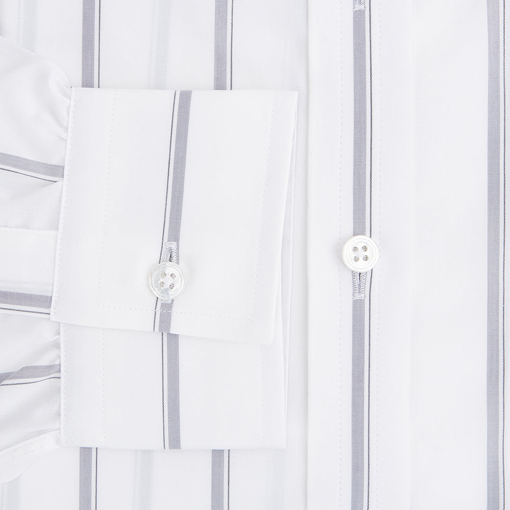 Introducing the Track Striped Grey on White Weekend Fit Shirt in Cotton by Turnbull & Asser UK—a men’s long-sleeve dress shirt crafted from crisp white cotton, featuring vertical grey stripes, a button-down front, derby collar, cuffs, and a chest pocket. The shirt is displayed laid flat on a white surface.