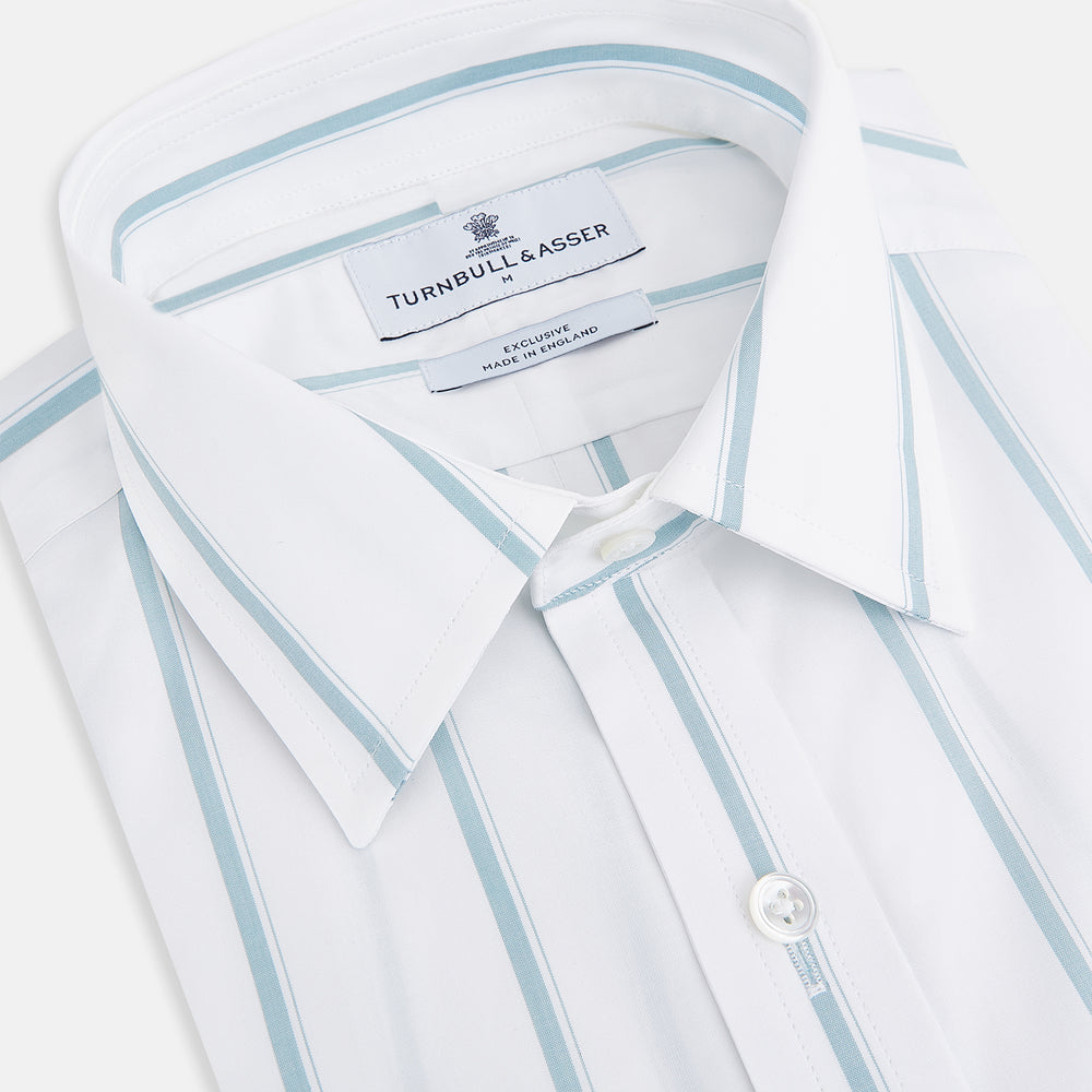The Turnbull & Asser UK SHIRTS WF DERBY COLLAR 1BC 1PKT WHITE/SAGE STRIPE shirt features thin vertical blue stripes, a pointed Derby collar, and a single front pocket on the left chest, displayed laid flat on a white background.