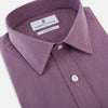 View 2 of product A long-sleeve, button-up pure cotton shirt—the Striped Navy on Antique Pink Weekend Fit Shirt by Turnbull & Asser UK—features subtle navy stripes on antique pink, a front chest pocket, white buttons, and a classic collar, displayed on a white background—a timeless nod to English shirtmaking.