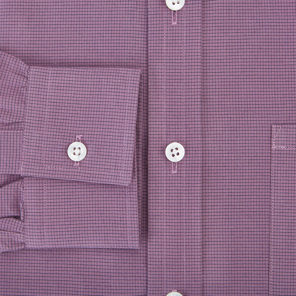 A long-sleeve, button-up pure cotton shirt—the Striped Navy on Antique Pink Weekend Fit Shirt by Turnbull & Asser UK—features subtle navy stripes on antique pink, a front chest pocket, white buttons, and a classic collar, displayed on a white background—a timeless nod to English shirtmaking.