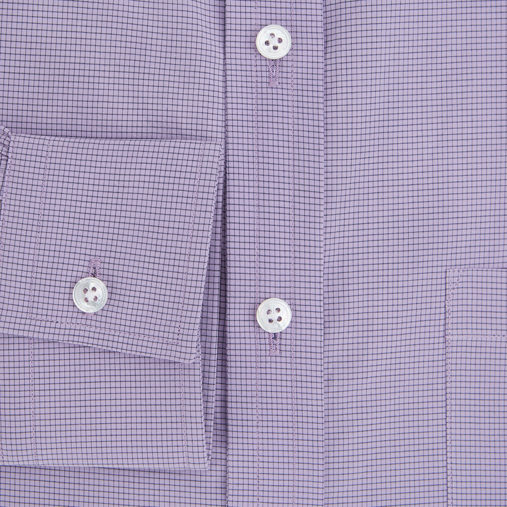 A long-sleeved, button-up Fine Checked Baby Pink Weekend Fit Shirt in Cotton by Turnbull & Asser UK, featuring a single chest pocket and a classic collar design, laid flat on a white background.