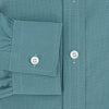 View 4 of product A Fine Checked Sage Green Weekend Fit Shirt in Cotton by Turnbull & Asser UK, featuring long sleeves, a button-up front, chest pocket, buttoned cuffs, and a classic collar—displayed on a white background—offers a modern twist reminiscent of the timeless appeal of classic checked shirts.