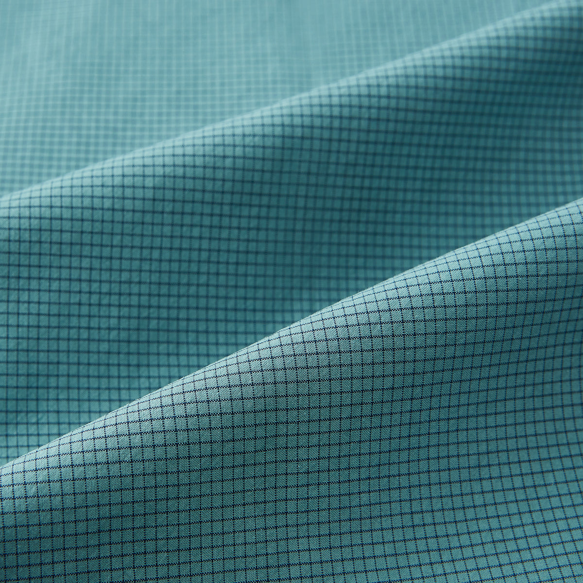 View 6 of product A Fine Checked Sage Green Weekend Fit Shirt in Cotton by Turnbull & Asser UK, featuring long sleeves, a button-up front, chest pocket, buttoned cuffs, and a classic collar—displayed on a white background—offers a modern twist reminiscent of the timeless appeal of classic checked shirts.