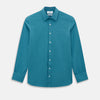 View 1 of product Here’s a rewritten version using your product data: The Turnbull & Asser UK Fine Checked Turquoise Blue Weekend Fit Shirt in Cotton is a men’s long-sleeve button-up, featuring a chest pocket, white buttons, and a pointed collar, shown laid flat against a white background.