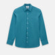 Here’s a rewritten version using your product data: The Turnbull & Asser UK Fine Checked Turquoise Blue Weekend Fit Shirt in Cotton is a men’s long-sleeve button-up, featuring a chest pocket, white buttons, and a pointed collar, shown laid flat against a white background.