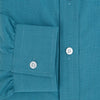 View 4 of product Here’s a rewritten version using your product data: The Turnbull & Asser UK Fine Checked Turquoise Blue Weekend Fit Shirt in Cotton is a men’s long-sleeve button-up, featuring a chest pocket, white buttons, and a pointed collar, shown laid flat against a white background.