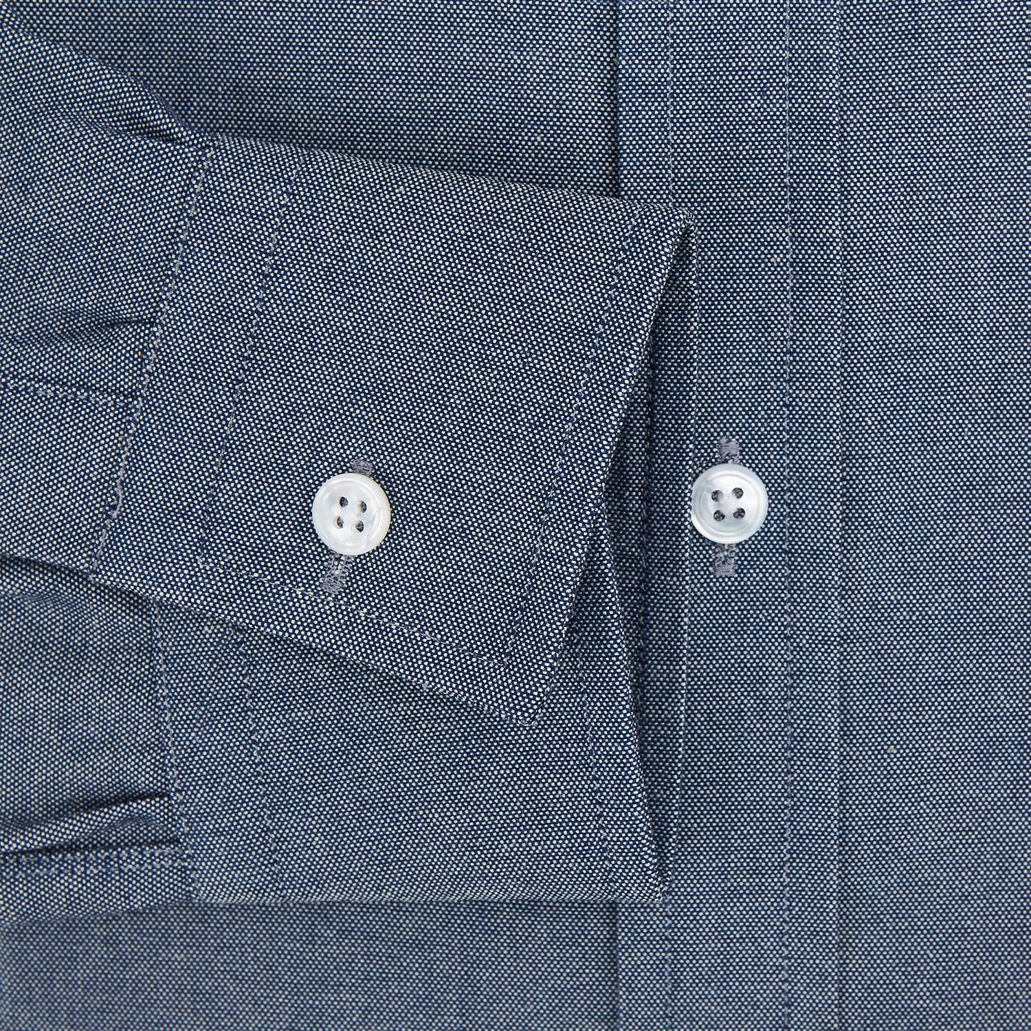 View 3 of product The Turnbull & Asser Steel Blue Richmond Shirt is a long-sleeved, button-up dress shirt with a Derby collar, single chest pocket, and buttoned cuffs—shown on a plain white background.