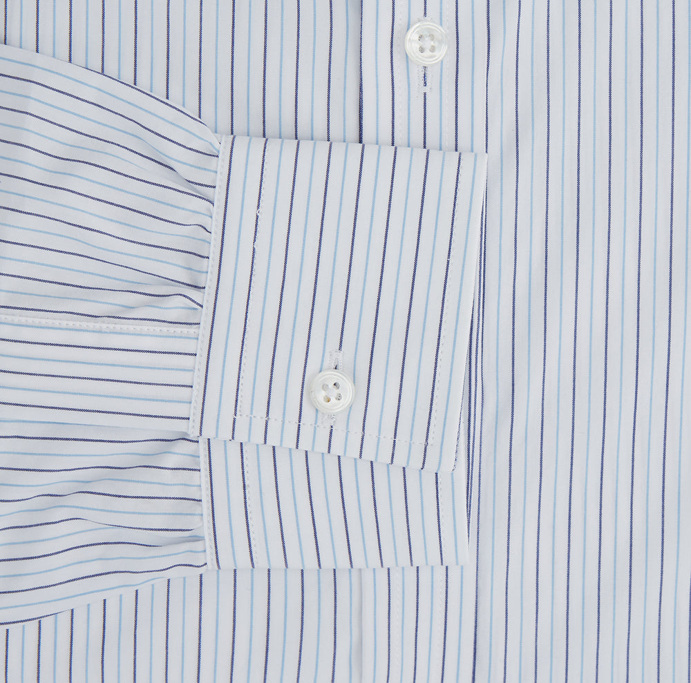 The Blue Double Pinstripe Richmond Shirt by Turnbull & Asser, featuring long sleeves, buttoned cuffs, and a button-down collar, is laid flat on a white background.