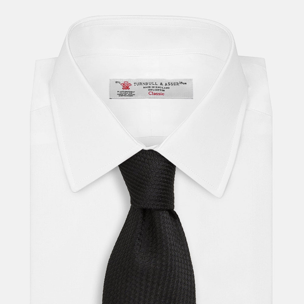 The Turnbull & Asser Black Lace Silk Tie, featuring a refined texture, is elegantly displayed on a white background.