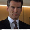 View 2 of product The Turnbull & Asser "The World Is Not Enough" Square Silk Tie, as seen on James Bond, features a geometric diamond pattern in black, red, yellow, and white on gray—an ideal stylish gift for any Bond fan.