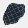 View 1 of product The Blue Diagonal Check Silk Blend Tie by Turnbull & Asser features a navy and light blue check pattern—a crisp accent for your favorite shirts.
