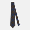 View 2 of product The Turnbull & Asser Blue and Brown Tartan Silk Blend Tie, rolled up to show intersecting patterns, is displayed against a plain white background.