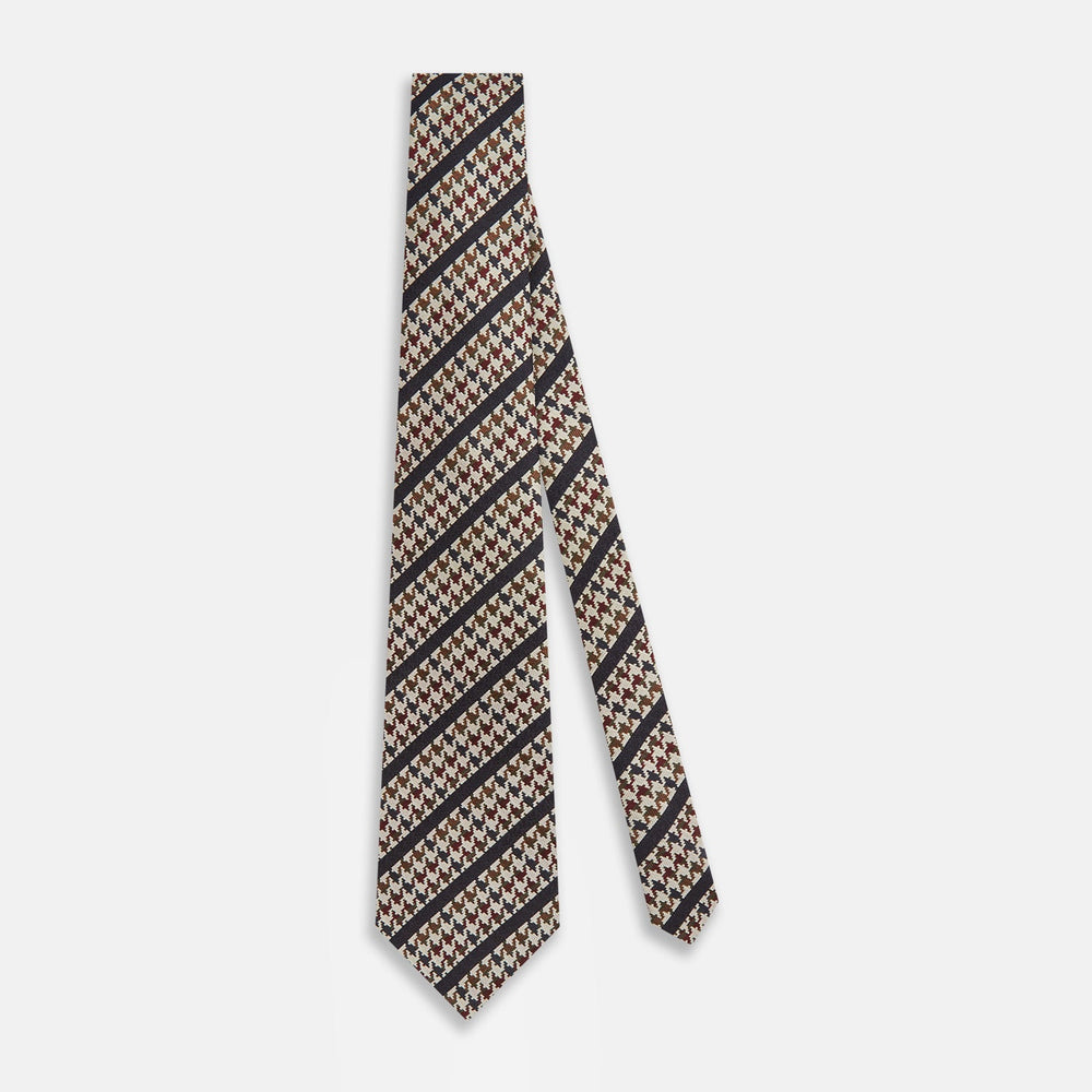The Turnbull & Asser Brown Houndstooth Stripe Silk Tie features a houndstooth pattern with diagonal stripes, crafted from silk for a refined finish—ideal to pair with Turnbull & Asser shirts.