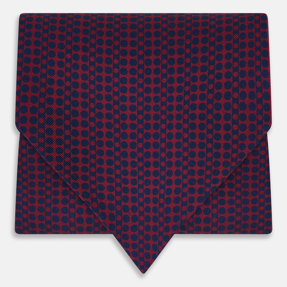 The Burgundy Micro-Dot Bar Printed Silk Cravat by Turnbull & Asser UK features a British style with a navy background, vertical red dots, and diagonal burgundy and navy stripes.