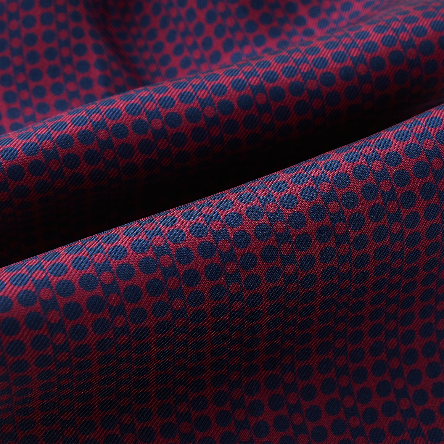 View 4 of product The Burgundy Micro-Dot Bar Printed Silk Cravat by Turnbull & Asser UK features a British style with a navy background, vertical red dots, and diagonal burgundy and navy stripes.