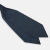 View 3 of product Geometric Navy Quatrefoil Motif Ascot Tie in Silk in navy blue with a repeating white and light blue geometric quatrefoil motif and fine grid lines.